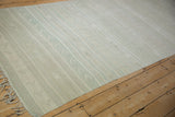 Distressed Turkish Kilim runner, raised linear geometric motifs with subtle texture in light blue and ivory.