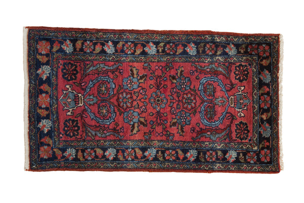 Vintage Persian Mehreban rug with raspberry red field, scrolling tendrils, blossoms, and navy Herati border.