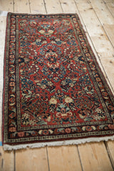 Detail of vintage German Sarouk runner: red field with delicate floral sprays and pinwheel blossoms.