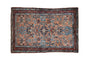 Dusty copper vintage Persian Mehreban rug, central floral pinwheel medallion, with blue and burgundy motifs.