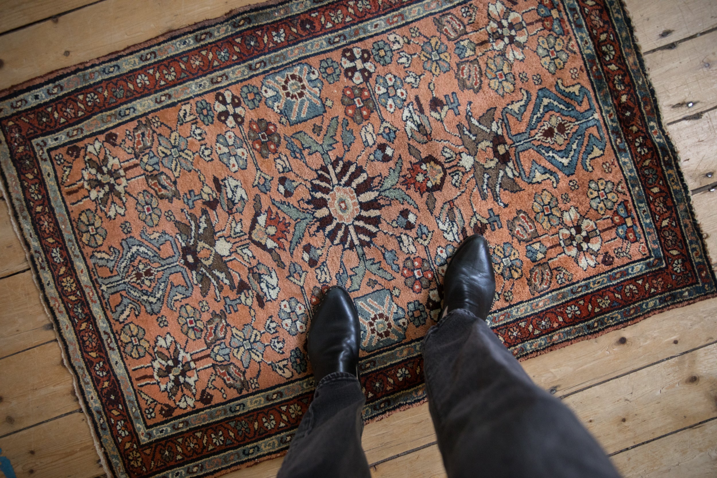 Densely ornamented floral blossom and vine field with copper, denim blue, and burgundy tones.
