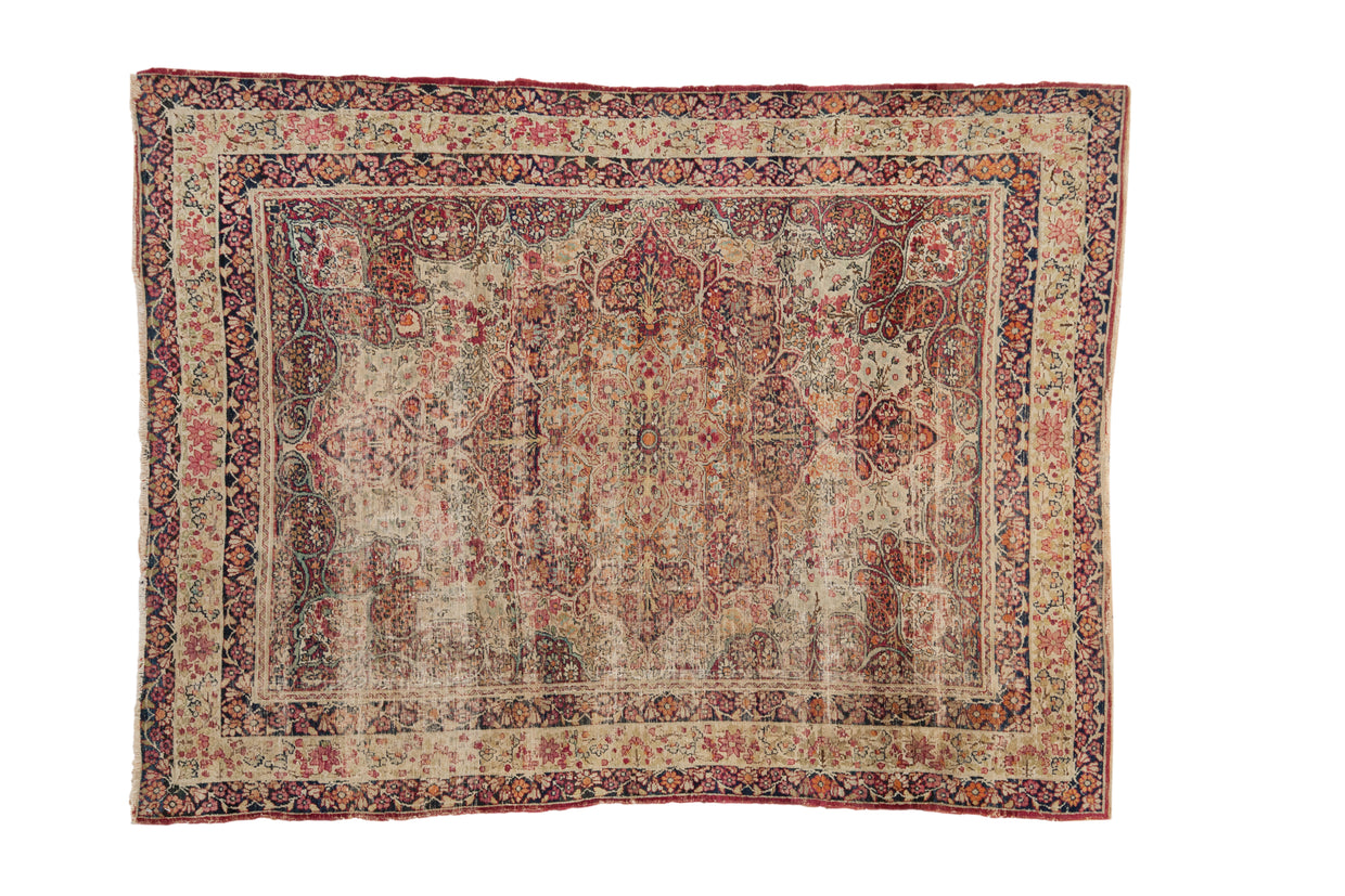 Antique Kerman rug, central starburst medallion on ivory ground, thousand flower field in red, navy.