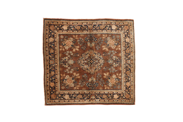 Vintage Sarouk square rug with roundel medallion, allover floral bouquets in chestnut, navy, and ivory.