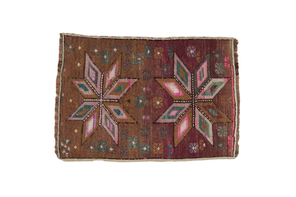 Distressed vintage Kars rug mat, double starbursts on an abrashed aubergine field, 1'7" x 2'3".