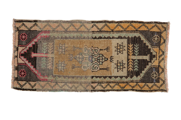 Distressed Kars rug with central starburst floral and geometric patterns, ochre, charcoal, magenta.