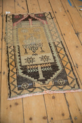 Distressed Kars rug, geometric finned stem motifs and primitive vine border.