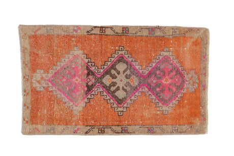 Vintage Distressed Kars rug with triple geometric medallions in terra cotta, fuchsia, beige.