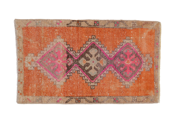 Vintage Distressed Kars rug with triple geometric medallions in terra cotta, fuchsia, beige.