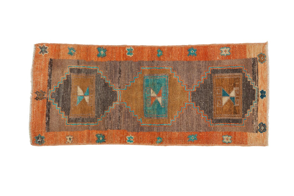 Distressed vintage Kars runner rug with triple medallions, terra cotta border, and turquoise accents.