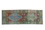 Distressed Anatolian runner rug, burgundy field, faded blue-green geometric medallions and borders.