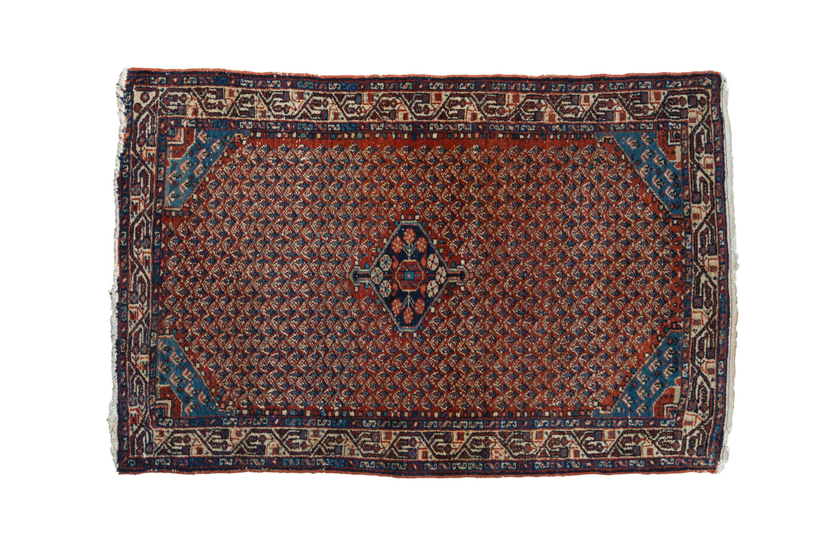 Vintage Tajabad rug, madder red allover boteh pattern, sapphire blue medallion, Serbend border. 2'8" x 4'1".