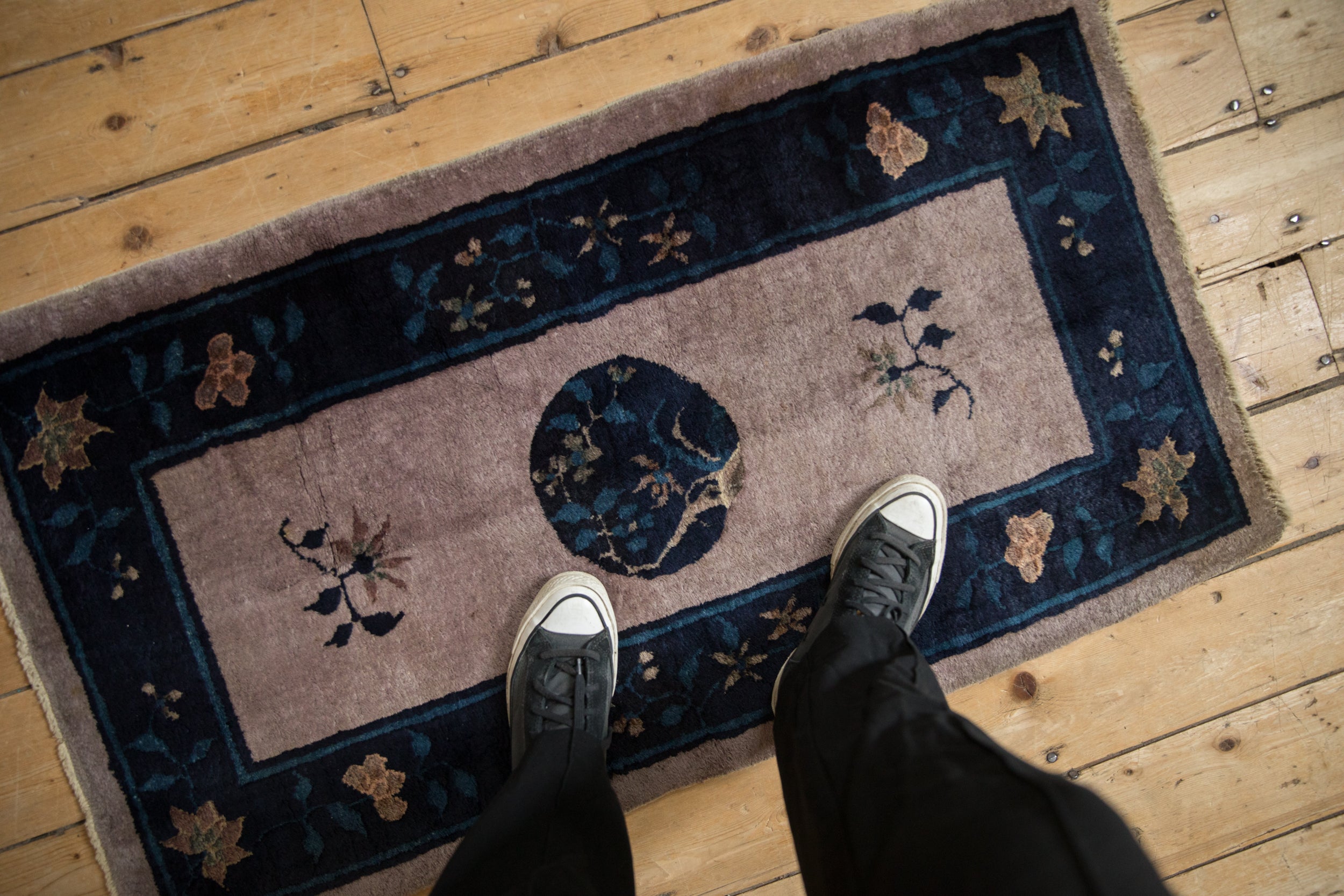Antique Peking transitional runner with rare mauve field, central dark blue tree medallion, and floral border.