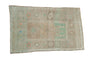 Faded distressed Oushak rug with ivory, beige, mint green geometric-pomegranate design, 2'7" x 4'.