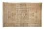 Distressed Vintage Kars carpet with geometric medallion, rams horn motifs, and neutral tones.