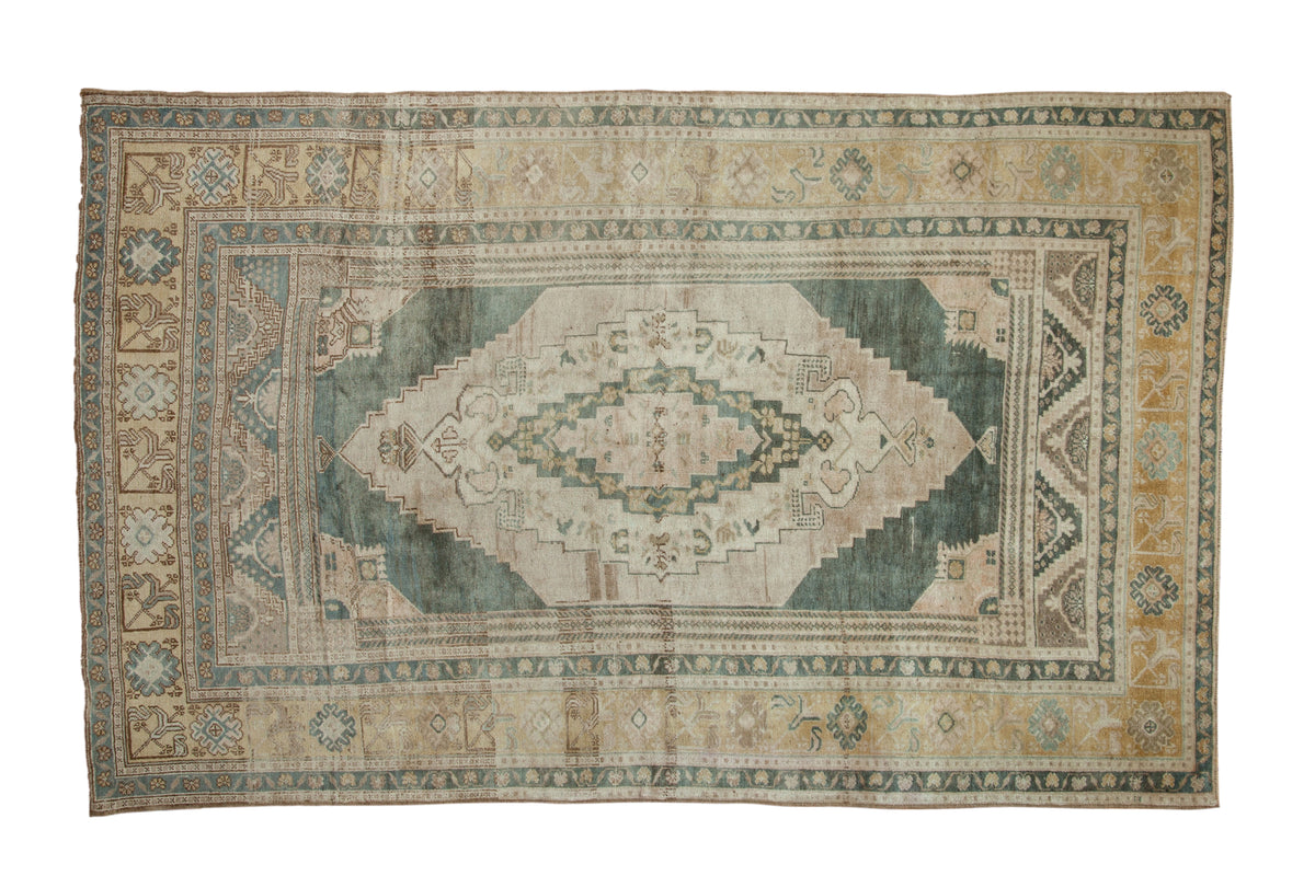 Vintage Distressed Oushak carpet, muted teal medallion, light beige and gold tones. 5'7" x 8'9".