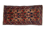 Hand-knotted Belouch rug, geometric palmettes, serpent border in camel, navy, brick red.