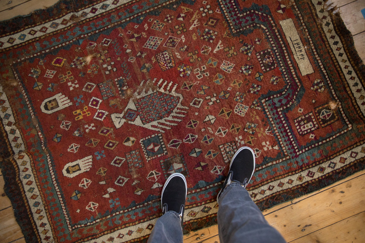 Late 19th century hand-knotted Kazak rug with red field and geometric prayer design. 3'11" X 5'4".