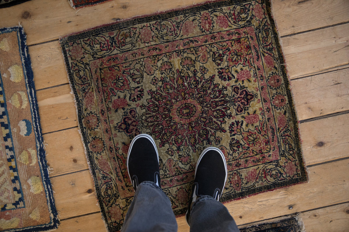 Antique Kerman square rug, elaborate floral medallion, arabesque border, ivory, red, navy.
