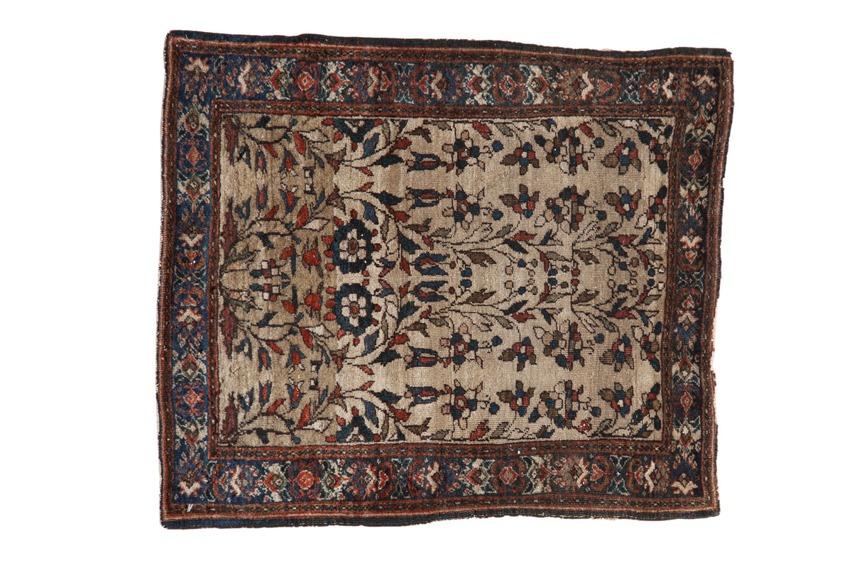 Antique Farahan Sarouk Persian rug, allover floral vine pattern on a beige field, navy border, 2' x 2'3".