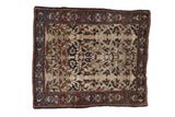 Antique Farahan Sarouk Persian rug, allover floral vine pattern on a beige field, navy border, 2' x 2'3