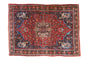 Vintage Bijar carpet: ruby red field, central medallion, dense vak-vak floral design, sapphire blue peacock corners.
