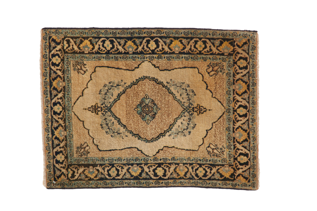 Antique Tabriz rug, circa 1920s, central scalloped medallion and dark palmette border.