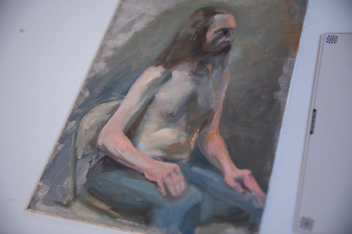 Expressive brushstrokes and face of the shirtless man in Dianne Aronian's oil painting.