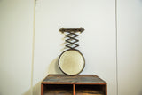 Antique beveled glass accordion shaving mirror with fleur de lis hardware and darkened patina.