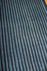Hand woven vintage indigo blue striped textile with subtle character and varied hues.