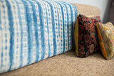 Intricate hand-dyed patterns on vintage indigo blue and white striped throw.