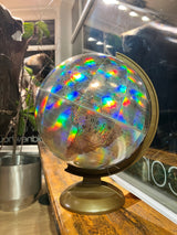 Vintage Replogle Prism Holographic World Globe with rainbow colors and bronze stand, 12-inch.