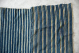 Handwoven cotton African indigo textile, striped pattern with visible panel join.