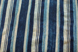 Vintage indigo blue striped textile showing unique hand-woven texture and varying hues.