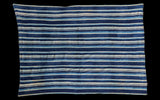Hand woven indigo blue striped textile throw with varied blue shades, 3'6