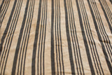 Collectible hand woven indigo striped textile with unique cotton texture.