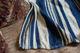 Close-up of the supple handwoven vintage indigo stripe cotton textile.
