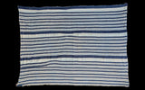Textured vintage hand-dyed indigo striped cotton throw, showing subtle variations.
