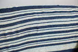 Handwoven texture and varied indigo blue stripes on a vintage throw.