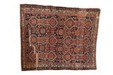 Antique Malayer rug with a powerful geometric design in navy blue, jewel red, and oxidized copper green.