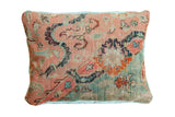 Antique Turkish rug fragment pillow with faded rose, blue, and teal historic motifs, 16x20.