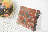 Antique Heriz Rug Fragment Pillow, rich red and blue geometric patterns, with softened texture, 12x15 inches.
