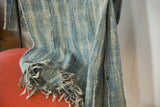 Vintage African indigo textile with hand woven ivory and blue stripes, detailed fringe.