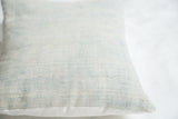 Detail of sun-faded powder blue indigo textile, showing its unique woven texture.