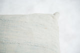 Close-up detail of the sun-faded powder blue vintage African Indigo textile on the pillow.