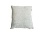 Vintage faded powder blue indigo pillow showing horizontal woven texture.