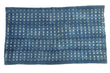 Vintage African indigo textile throw, hand woven with ivory and denim blue patterned design.