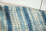 Hand woven vintage African indigo textile with unique blue and ivory patterned stripes and textured stitching.