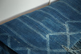 Supple hand-woven denim blue African indigo textile with unique light geometric design.