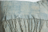 Fringe detail on sun-faded vintage light blue indigo pillow.