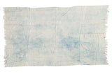 Vintage African indigo textile throw, hand-woven with ivory and powder blue cloud patterns, fringed.